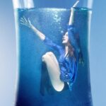 woman, water, submerged, glass, drinking glass, female, feminine, clothing, person, pose, posing, surreal, imagination, fantasy, layout, image editing, image design, photomontage, photo manipulation, photoshop, visualization, art, artistic, composing, composition, nature, compositing, artwork, image synthesis, rendering, computer graphics, image factory